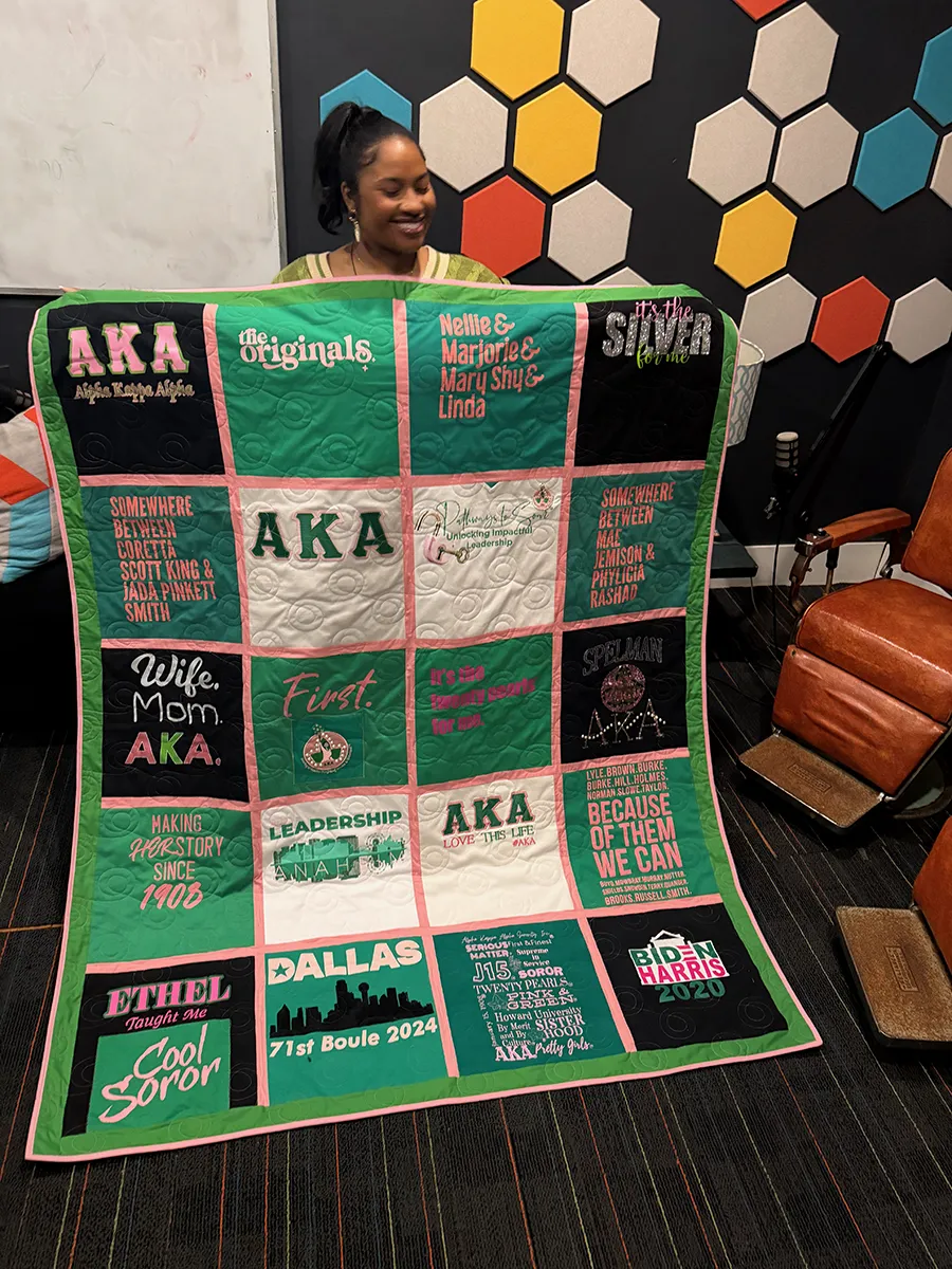 Close up of pink sashing between AKA sorority shirt blocks in a custom memory quilt made in Atlanta by Wesley Hall