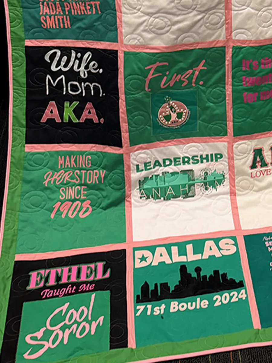 Green outer border and binding on a finished AKA sorority memory quilt laid out in the Quilts by Big Wes studio in Atlanta GA