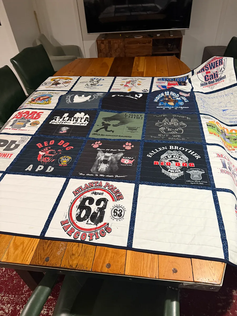 Close view of Atlanta Police Department K9 unit t-shirts arranged in a memory quilt made by Quilts by Big Wes in Atlanta