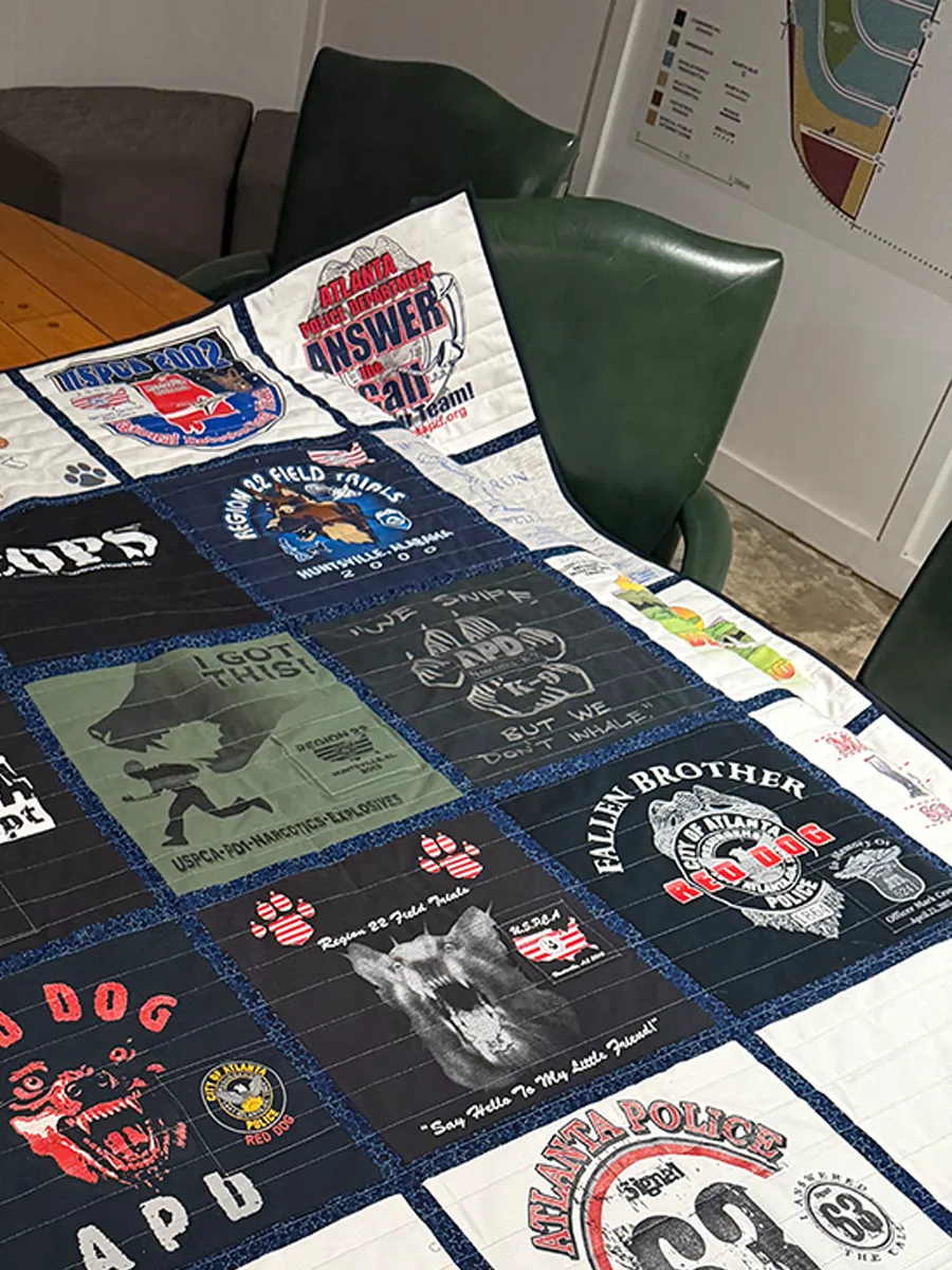 Memorial shirt panel incorporated into the finished K9 officer memory quilt, honoring a fallen Atlanta Police Department officer