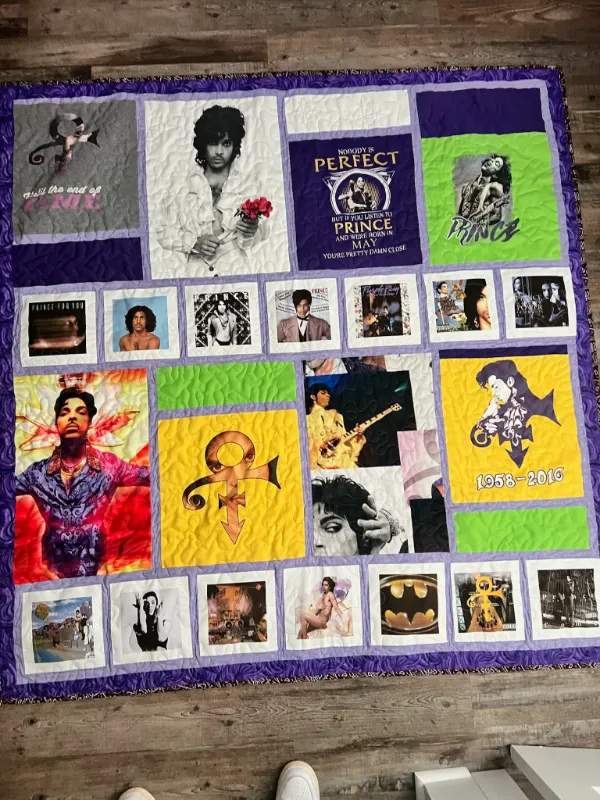 Prince tribute memorial quilt featuring album covers, photos, and memorabilia blocks in purple and gold, handmade in Atlanta by Quilts by Big Wes