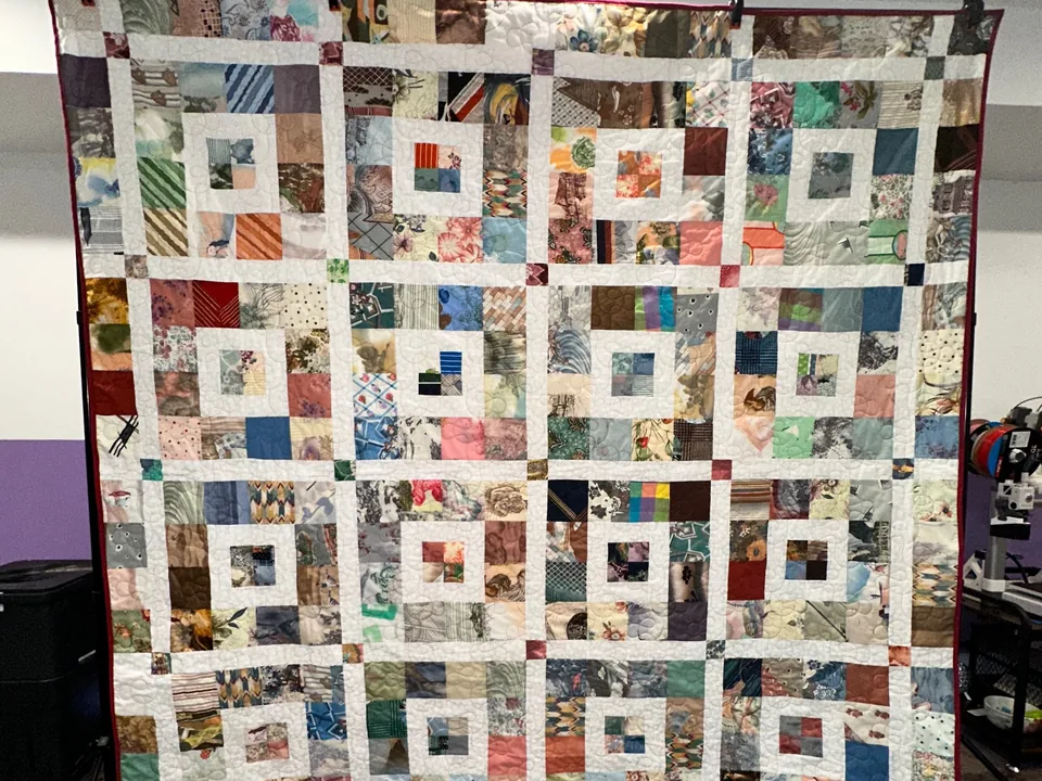 Custom memory quilt and longarm quilting service delivered to Judy Bell by Quilts by Big Wes