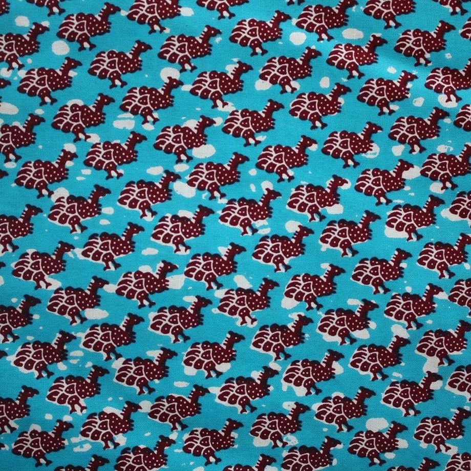 Guineafowl. A blue fabric with red and white birds.