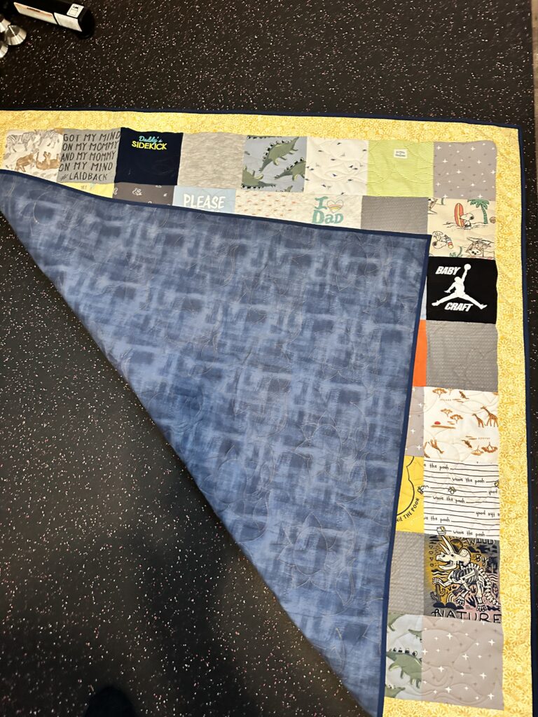 Custom quilt from baby clothes